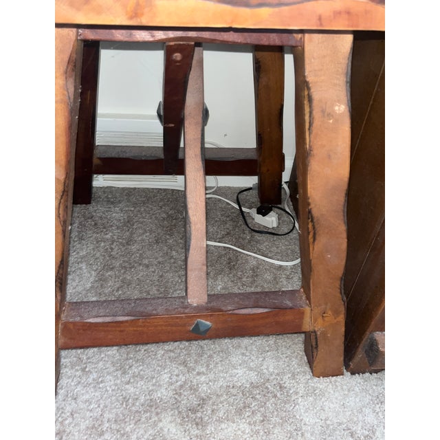Bring striking artisanal character into your space with this vintage, handcrafted rustic trestle-style side table. The...