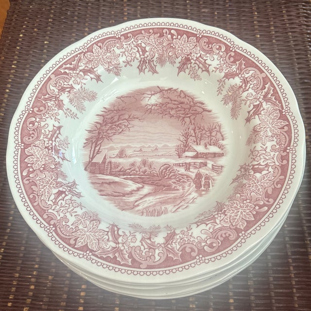 Spode Winters Eve Red 9” Rimmed Bowls-set of 12. The pattern features a center pastoral scene of a snowy cabin, bare...