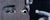 Up close, the work resolves into fragments: an eye, the bridge of a nose, the curve of a hand. Stepping back locks the...