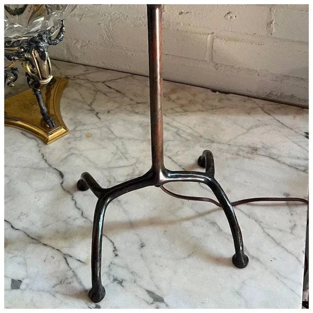 DETAILS An antique Tiffany Studios table lamp base with four root form legs, and slender stem supporting a three light...