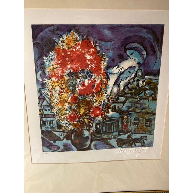 This print made by a lithographic technique is a reproduction of an original work by Marc Chagall. Name: Le bouquet et le...