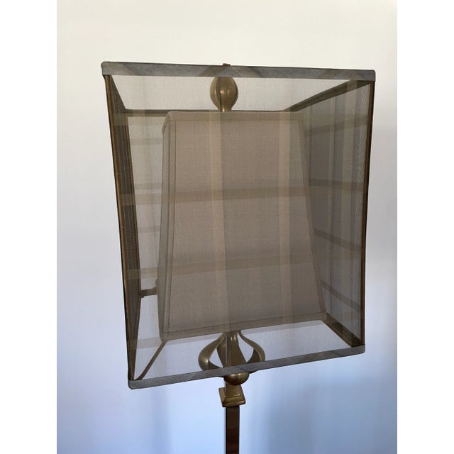 Beautiful brass floor lamp with double lamp shade. Wooden base has a few divots but otherwise in excellent condition!...