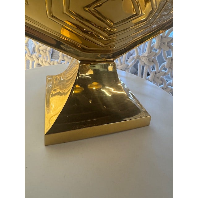 A striking vintage brass decorative turtle shell shaped touch lamp. It stands elegantly on a geometric pedestal base,...