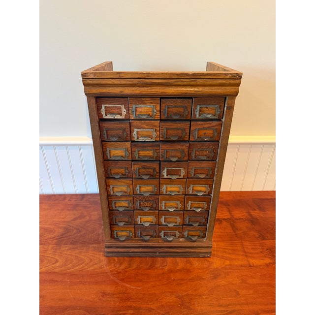 Early 20th Century Industrial Storage Cabinet with Original Metal Drawers An exceptional antique 32-drawer oak hardware...