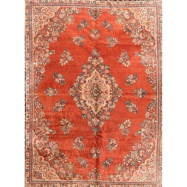 The floating flower sprays in the otherwise open rust-red field are a trace of the "American style" pattern, as are the...