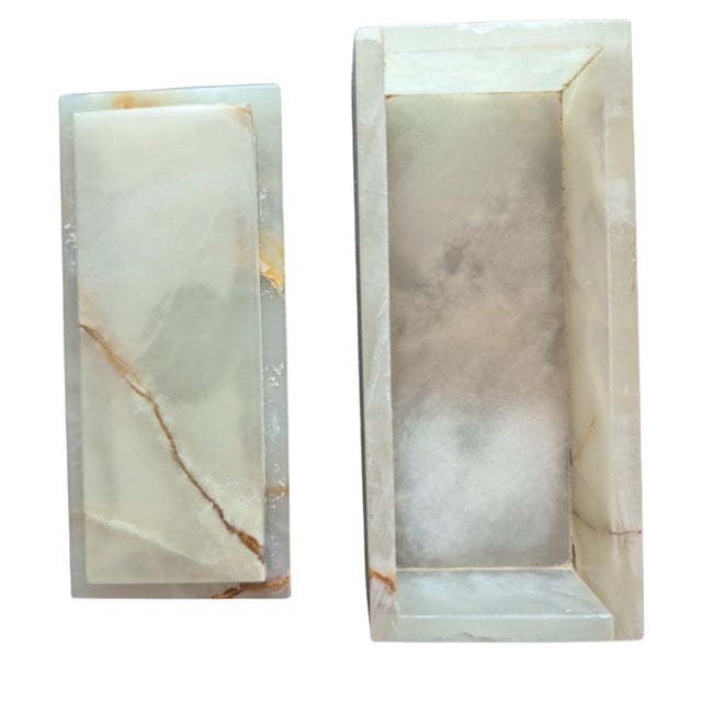 A beautifully hand-carved vintage white onyx box featuring soft translucent stone with warm caramel and honey veining...