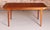 A mid century extending dining table designed by mcintosh and produced in the 1960s. Constructed in teak with a softly...