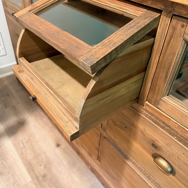 Reclaimed Wood Storage Cabinet/Dresser Charming glass-topped pull-out bins and a multi-drawer base are reminiscent of an...