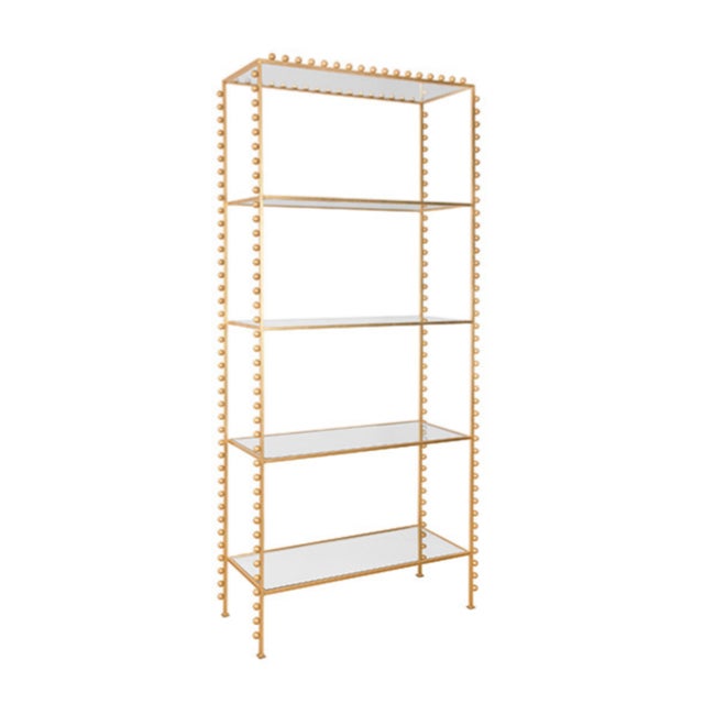 New special order item. Not vintage. The Goldie Etagere is a tall open shelved bookcase with a ball lined design in gold...