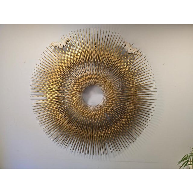 Exceptional 18th-century carved and gilt wooden sunburst, a unique sculptural work representing a radiant sun with...