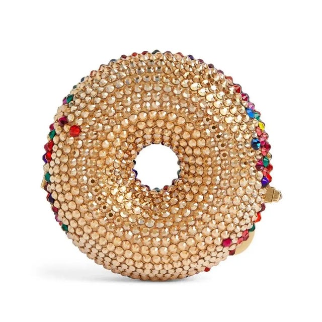 Good enough to eat, though we recommend you don't. Colorful and mouth-watering, this donut pillbox in colorful handset-...