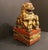 Early-mid 20th century carved, red lacquer and gilt female foo lion, Chinese. Attached to conforming hollow stand base...