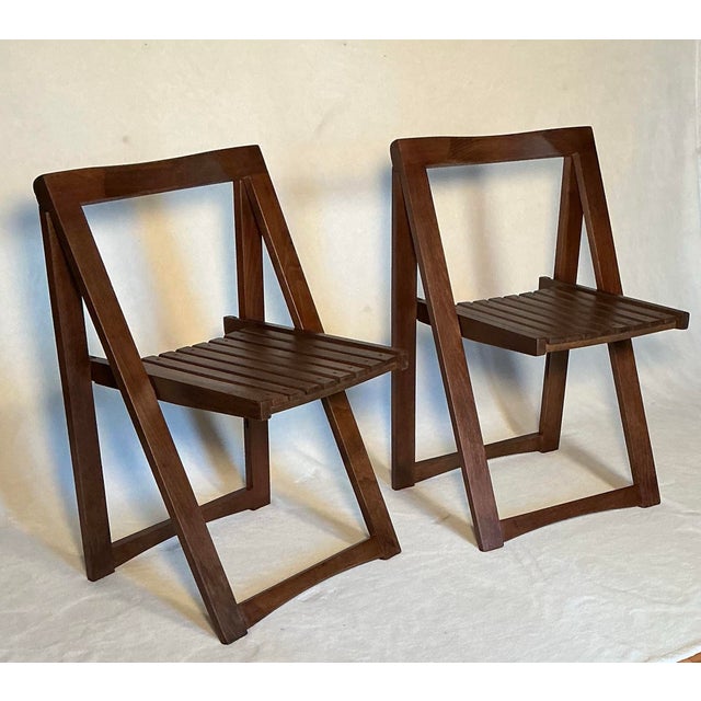 Pair of vintage mid-century modern wooden folding chairs,"Trieste" model in walnut, designed by Aldo Jacob for Alberto...
