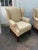 Pair of wingback chairs by St. Timothy Chair Company American made, high quality. It features curved upholstered back...