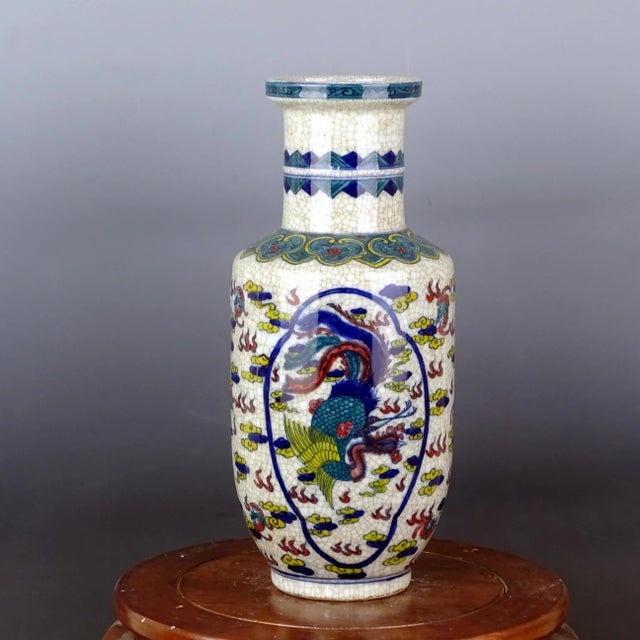 H-40cm,W-19cm This Blue and White Famille Verte Porcelain Mallet-Shaped Vase with Kylin and Phoenix is a vintage piece of...