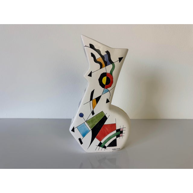 A striking vintage ceramic vase by Ceramar, Spain, featuring a bold hand-painted abstract design inspired by the playful...