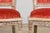 A pair of antique French Louis XVI style side accent chairs sourced from Paris, France. with trapezoidal upholstered backs...