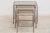 Vintage mid-century nesting tables. Modernist silver and brass tone frames with smoked glass tops.dimensions:small:32w x...