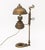 Vintage Brass Adjustable Electrified Oil Lamp, with hand and circular base. 19.25" H x 10.5" W x 6.75" D. Provenance: From...