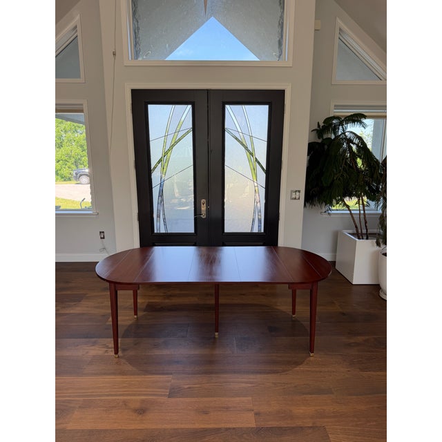 A beautifully crafted example of late 20th-century American furniture making, this elegant Henkel-Harris Wild Black Cherry...