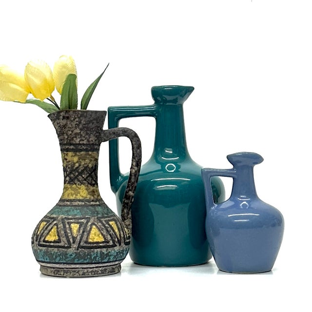 Blue and green pitchers, group of 3. This set of blue and green-toned ceramic long-neck pitchers is a beautiful mid-...