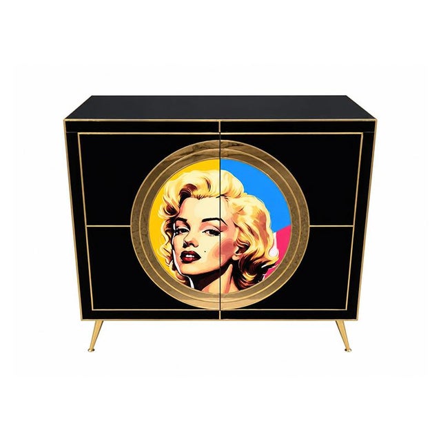 A striking sideboard featuring an elegant contemporary design with pop art references. The glossy black lacquered...
