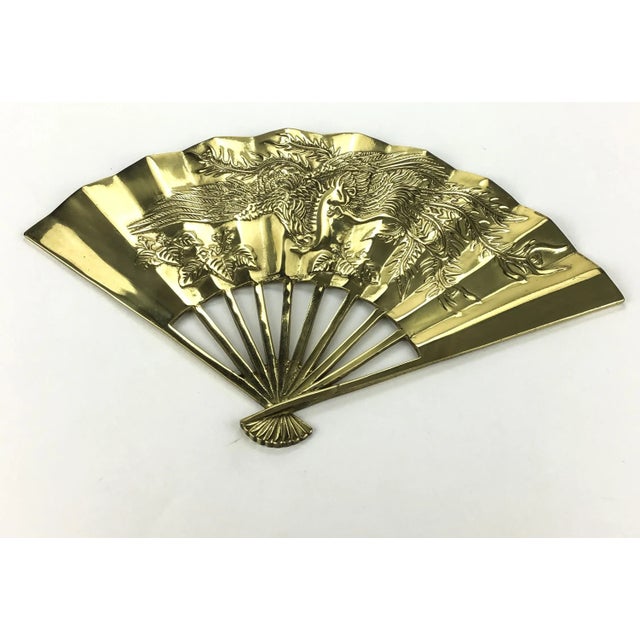 Beautiful heavy solid brass fan to add Asian or eastern theme and style to your walls. We have 2 identical fans and pay...