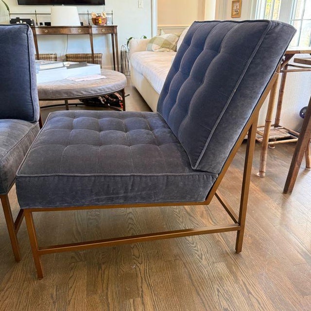 Pair of modern armless chairs by Mitchell Gold + Bob Williams, featuring tufted attached cushions in Indigo performance...