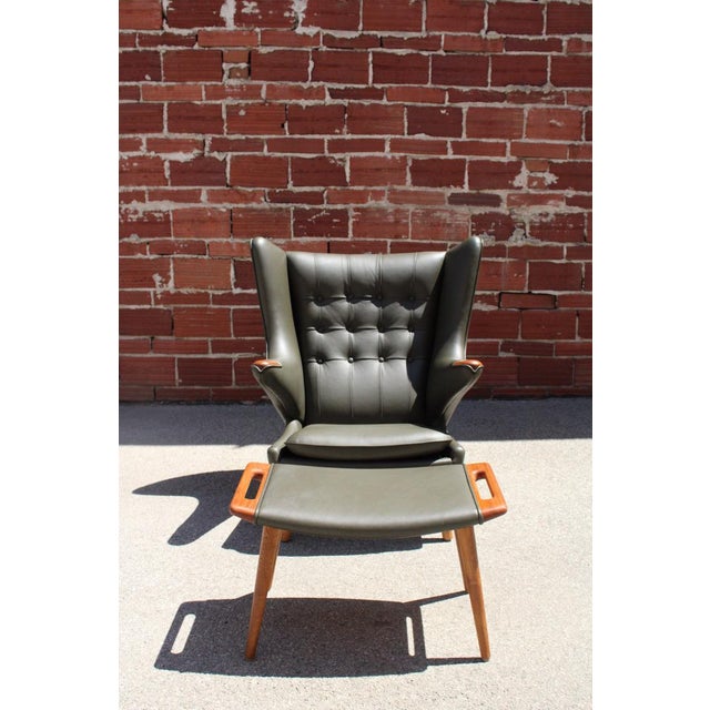 Original 1950’s, Reupholstered & Restored by Modernica in Premium Forest Green Leather. Ottoman: 27.5” wide. 16” deep....