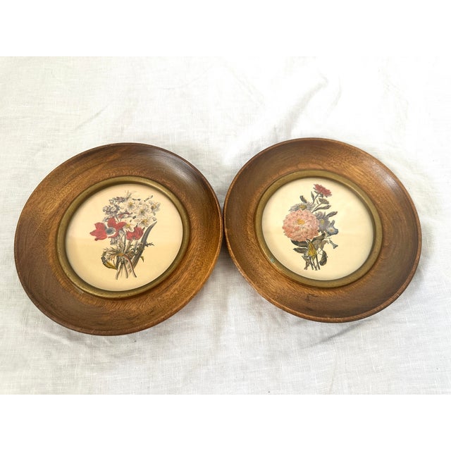 Pair of small round wood framed floral pictures. These would be super cute on a bookshelf or kitchen nook. 6in w x .75in d...