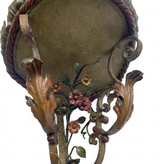 Pair of Polychrome Wrought Iron Corner Shelves, Early 1900s. Italian Art Nouveau artifacts consisting of a sheet metal top...