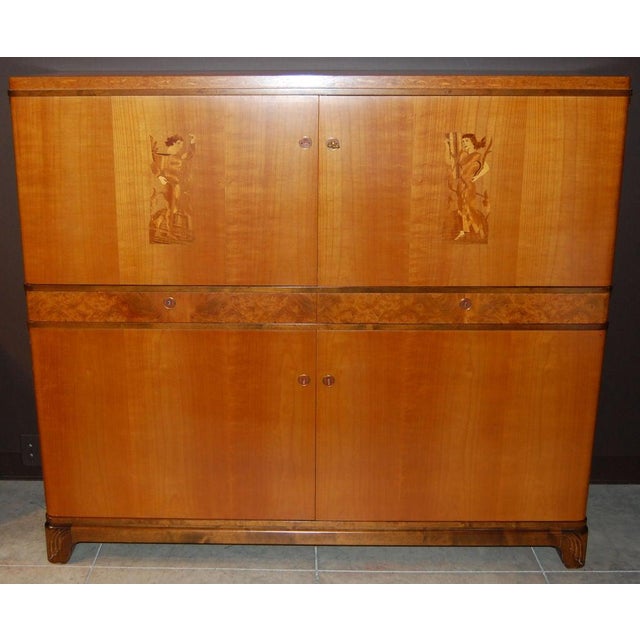 Swedish Art Deco, verging on Art Moderne, storage, bar cabinet in elm, Carpathian elm and dark flame birch with intarsia...