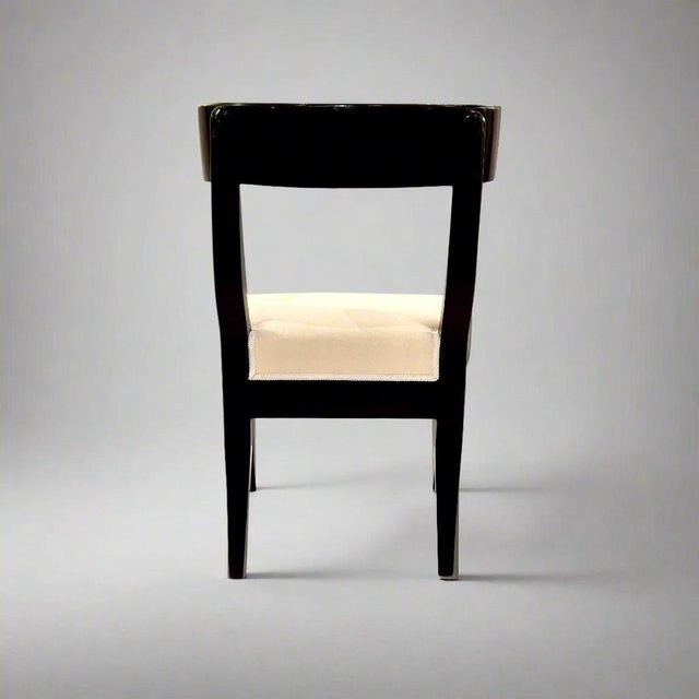Pair of Klismos Early 19th Century ebonized side chairs. Ebonized wood.