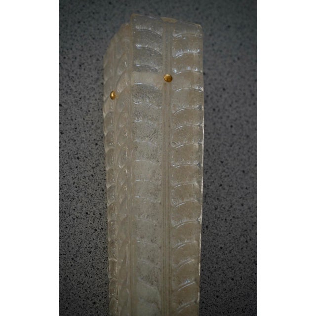 A highly original Murano glass wall light with an elongated design of glass leaves in a unique light gold color. The wall...