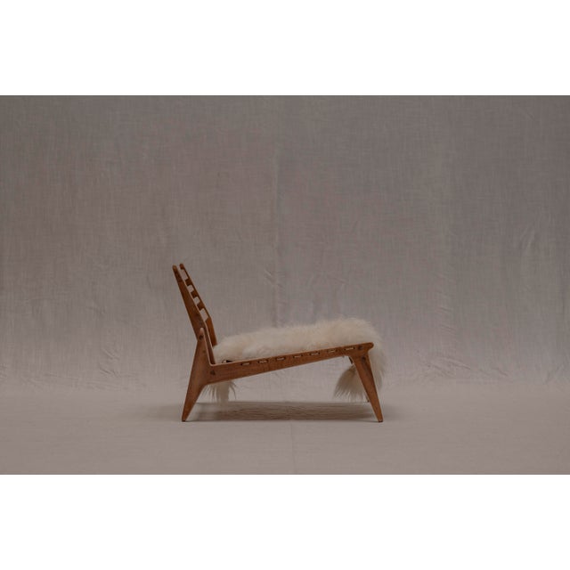 Rare vintage ‘Hunting’ lounge chair by VEB Deutsche Werkstätten Hellerau, Germany, circa 1950s. This beautifully crafted...