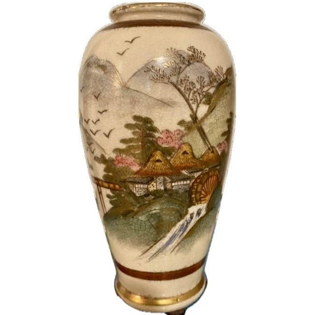 A pretty Satsuma Japanese face with pretty scenic detail and nice colors. It has a crackle finish. Age: unknown. I guessed...