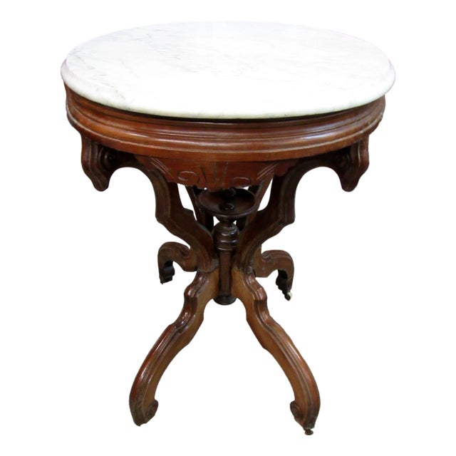 Antique Victorian Marble Top Parlor Table With Ornate Carved Wood Base & Wheels For Sale