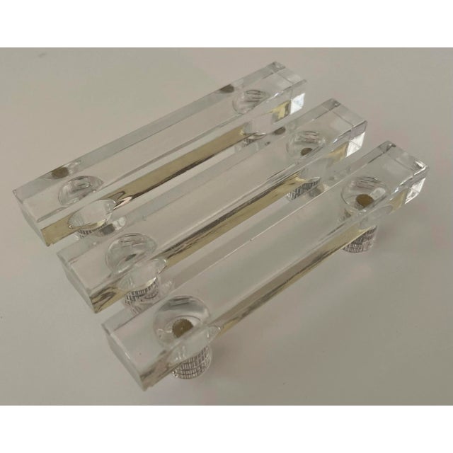 Set of 3 1960s lucite drawer pulls. Very good overall condition, lucite remains clear. Installation hardware is not included.