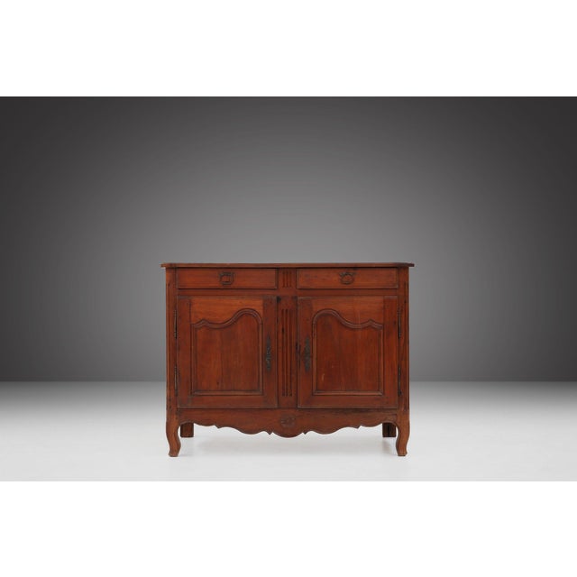 A charming early‑19th‑century French Provençal cabinet, crafted around 1820 and embodying the rustic elegance and regional...