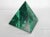 Decorative malachite pyramid figure crafted from sourced natural malachite. No maker's mark.