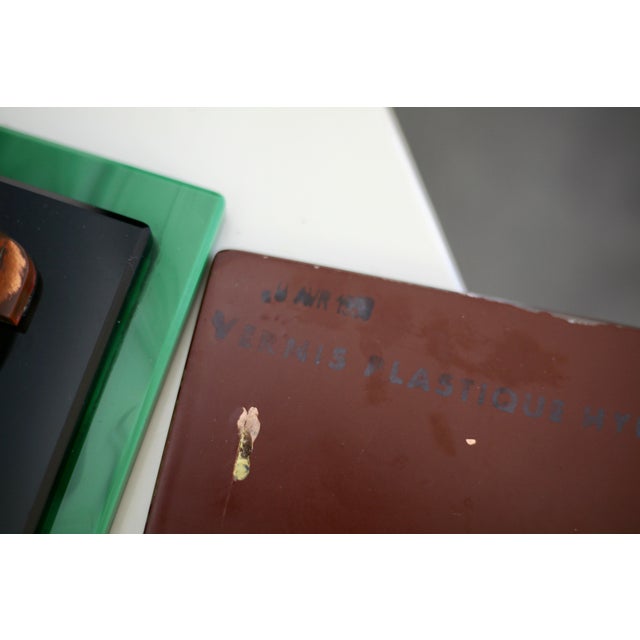 Smoked mirror, black glass and green stone support, France, 1958. Light stain pitting. In good condition.