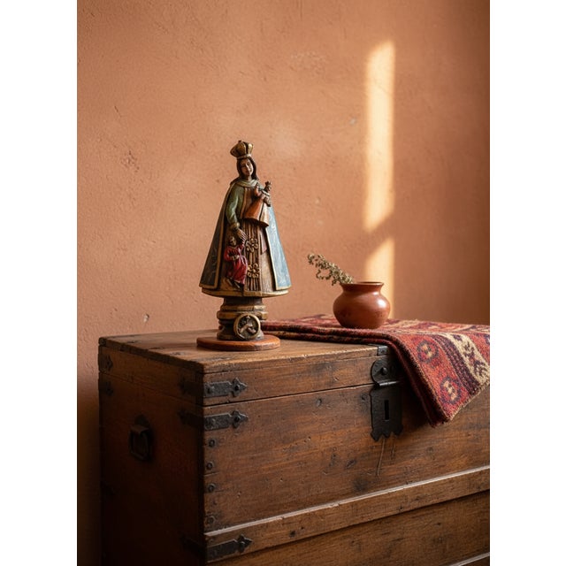 Spanish Colonial santos are religious folk art carvings, typically of saints or biblical figures, created in the Spanish...