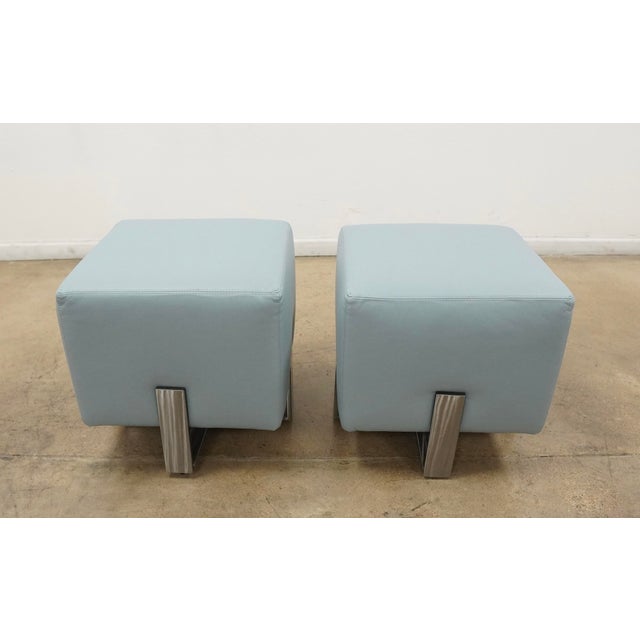 A pair of Lillian August Danielli Ottomans showcasing a sleek contemporary design with clean architectural lines and a...