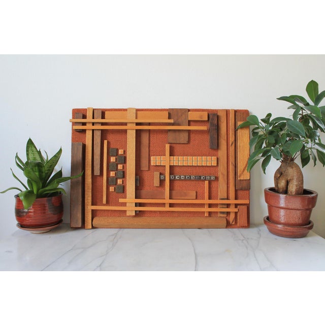 Handmade mid-century modern or brutalist-style mixed-media wood assemblage wall art featuring geometric wooden elements...