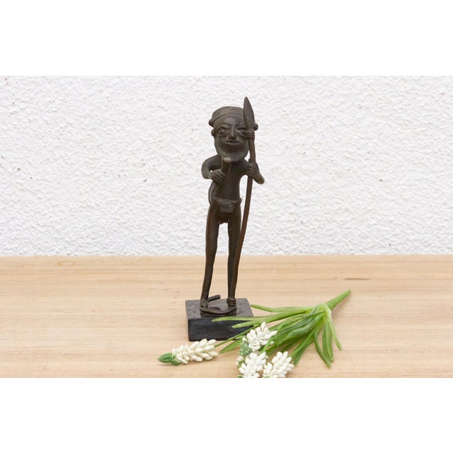 Bring a touch of Cameroonian artistry and cultural heritage into your space with this intriguing Bamum bronze figure....
