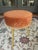Mid-Century Style Gold Metal Stool with Burnt Orange Upholstery Add a touch of vintage elegance to your space with this...