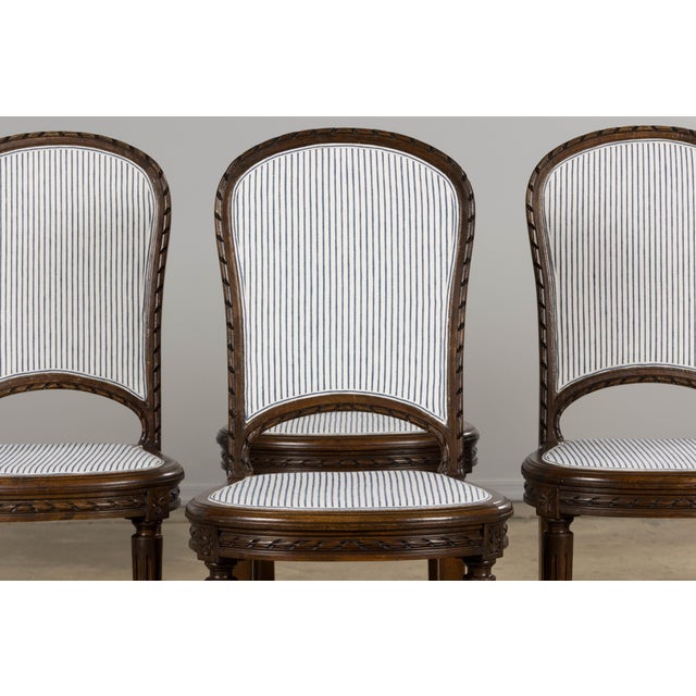 A classic set of six French Louis XVI style side chairs dating to the late 19th century, sourced in Provence. Crafted from...