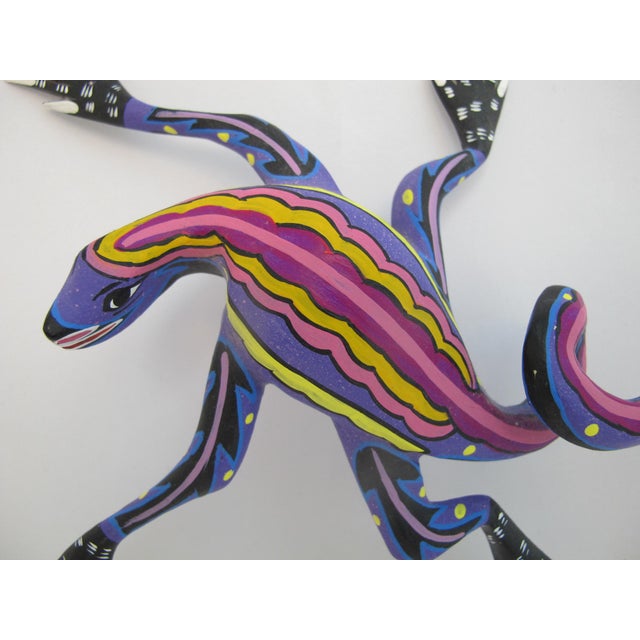 Hand-carved Oaxacan Alebrije lizard, masterfully crafted and signed by renowned folk artist, Susano Morales from Arrazola,...