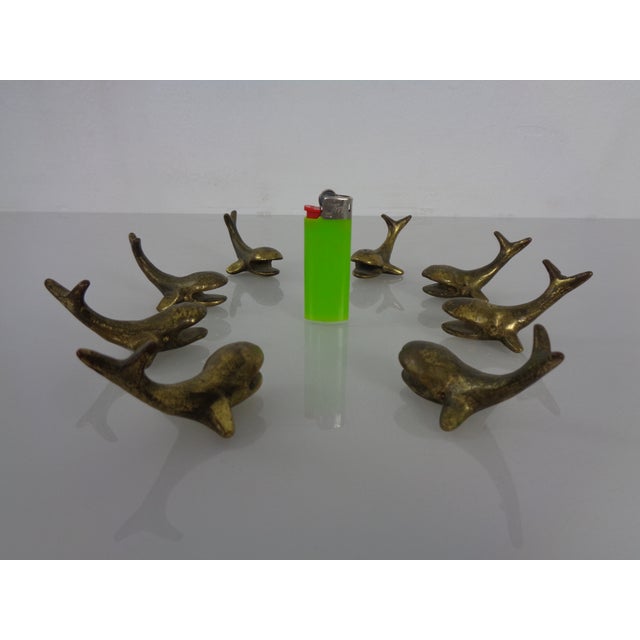 Set of four paperweights or knife rests crafted from solid brass, dating from the 1950s. Another set of four is available.