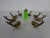 Set of four paperweights or knife rests crafted from solid brass, dating from the 1950s. Another set of four is available.